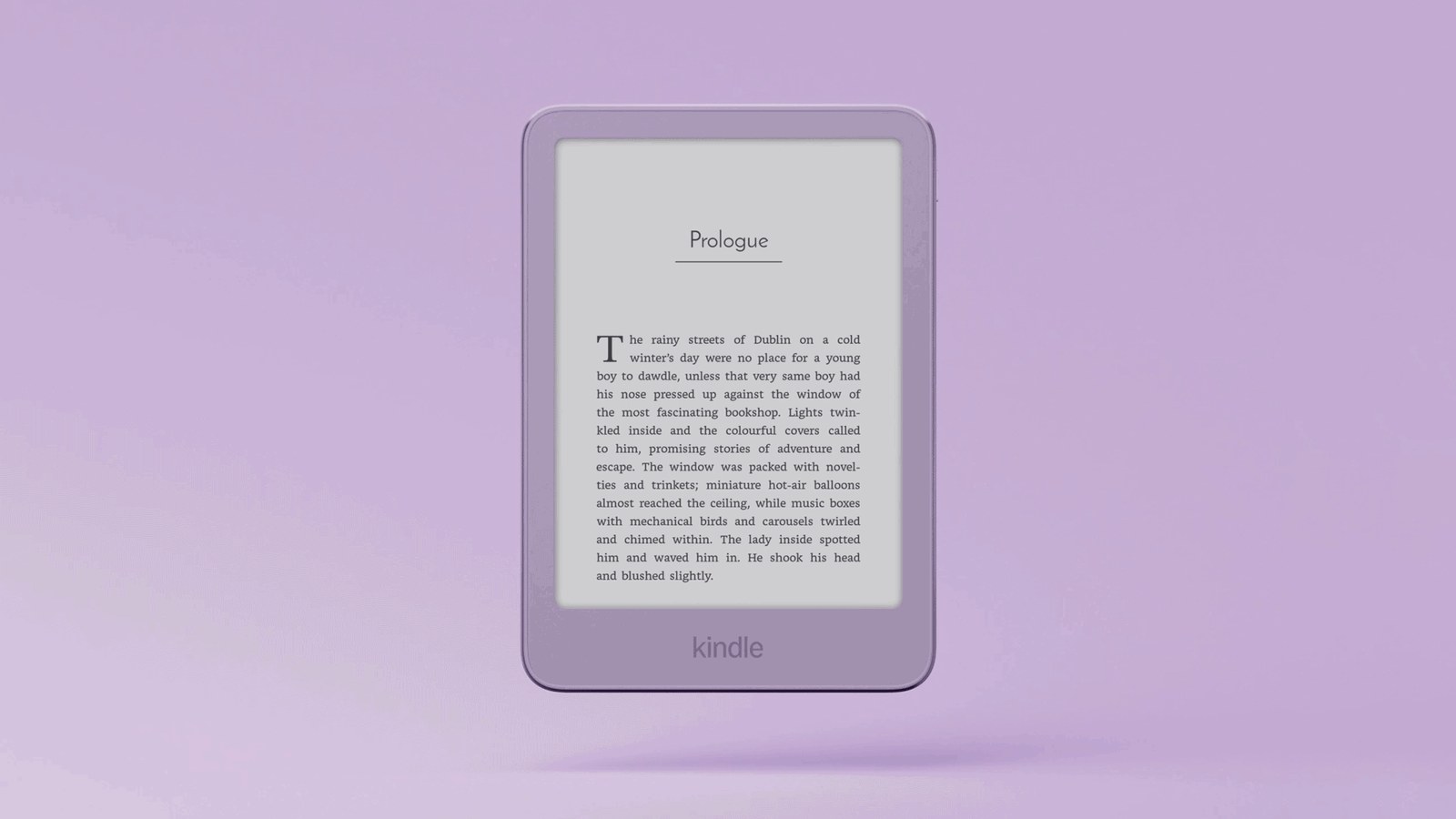 Kindle รุ่นพื้นฐานสีม่วง Ube ลอยบนพื้นหลังสีม่วง หน้าจอแสดงข้อความหนังสือ